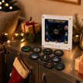 Christmas music frame with a Merry Christmas print and nine black vinyl-style NFC discs on a festive sideboard